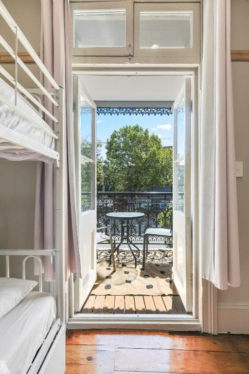 Mixed 2 Beds with Balcony (Shared Bathroom) — Photo 1